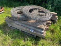 Wooden posts and barbed wire