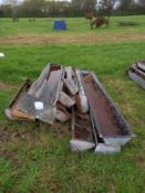 Quantity of metal feed troughs