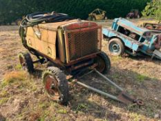 Vintage trailed compressor with 4 cylinder engine