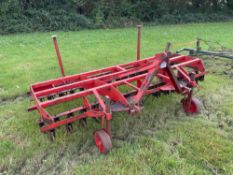 Spring time scarifier, linkage mounted