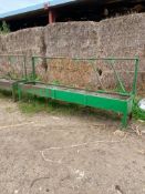 Feed barriers with troughs