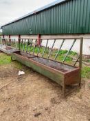 Feed barriers with troughs