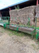 Feed barriers with troughs