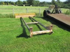 Front grain pusher with pin and cone brackets