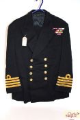 A Royal Navy dress jacket, label to M.H.A. Hewell