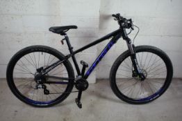 A Carrera Hellcat 29 mountain bike with aluminium