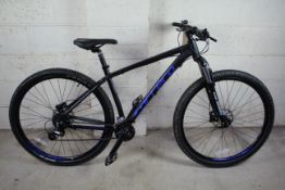 A Carrera Hellcat 29 mountain bike with aluminium