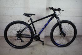 A Carrera Hellcat 29 mountain bike with aluminium