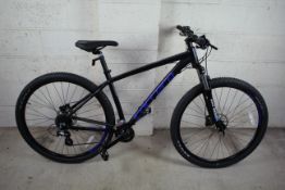 A Carrera Hellcat 29 mountain bike with aluminium
