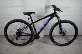 A Carrera Hellcat 29 mountain bike with aluminium