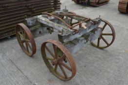 Set of four matching cast wheels on axles. Suit shepherds hut.