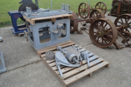 Cast iron rise and fall saw bench base. With parts.