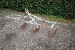 Shallow ridger mounted on Ferguson toolbar. No badge.