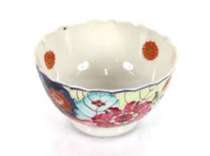 A Chinese tea bowl, with tobacco leaf decoration; an Oriental saucer dish; a Newhall similar; a