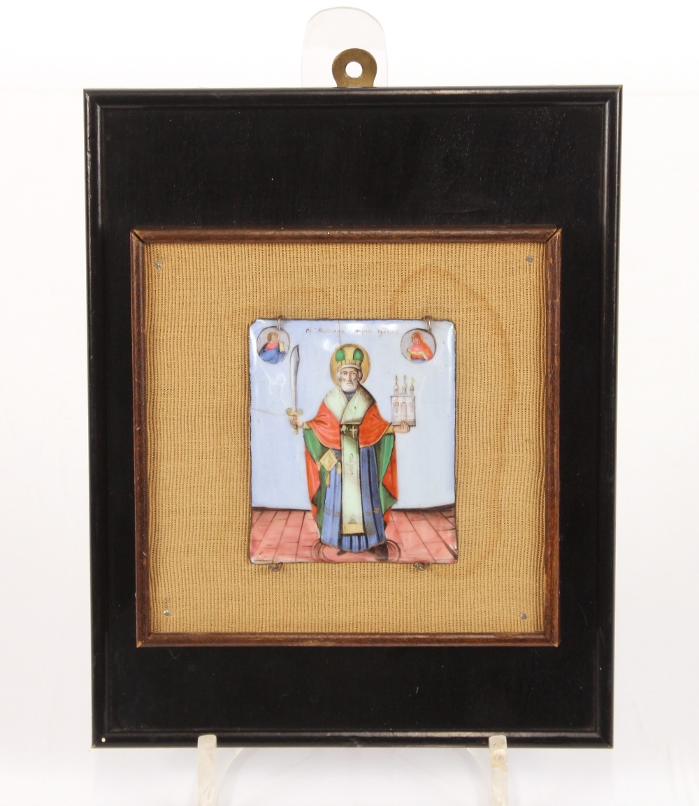 A small religious enamel icon, mounted on a plinth, inscription verso, states "Lent By Sir John