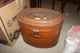 An oval metal hat box