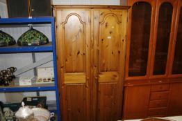 A Ducal pine two door wardrobe
