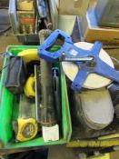 Green tray with various measuring tapes