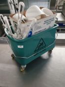 * green mop bucket and cleaning supplies