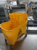 * yellow mop bucket