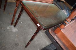 *Four Oblong Tables with Glass Tops and Another Tab