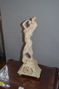 Distressed Figurine with Clock