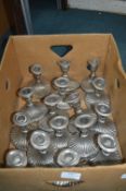Sixteen White Metal Candlesticks
