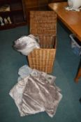 Wicker Storage Basket Containing Bedding