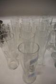 Sixteen Coca-Cola Glasses