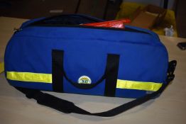 *Blue Holdall Containing Two Neck Braces, Breathing Equipment, and a Pelvic Stabiliser