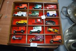 Display Case with Fifteen Diecast Advertising Vehi