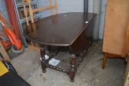 Circular Darkwood Drop Leaf Coffee Table with Bobb