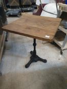 * table with cast base and wooden top 600w x 600d x 780h