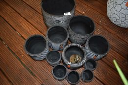 *Eleven Charcoal Coloured Plastic Planters