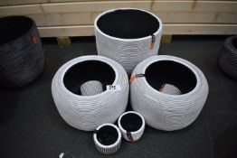 *Seven White Plastic Planters