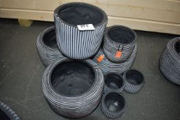 *Eight Grey Plastic Planters