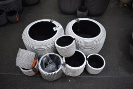 *Seven White Plastic Planters