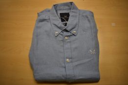 *Four Men’s Sky-Blue Shirts Size: M