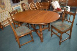 Ercol Oval Extending Dining Table with Four Matching Chairs