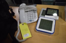 *Three Digital Clocks and a Telephone