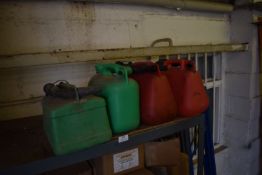 *Four Plastic Jerry Cans
