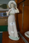 Lladro Nao Figure of a Young Lady with Flowers