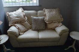 Two Seat Cream Leather Sofa plus Cushions