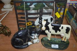 Cast Iron Painted Book Stand, and Two Door Stops