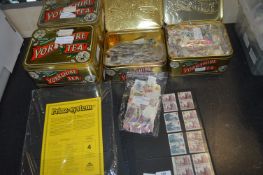 Six Tins of World Stamps and Blank Album Sleeves e