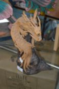 Figure of a Dragon on a Tree Stump