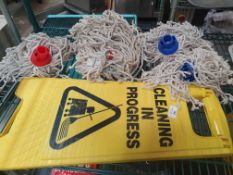 * mop heads and wet floor sign