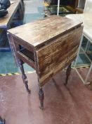 * drop leaf tall table on castors. 600w x 400-1200d x 1000h