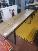 * folding bench - wooden top and heavy metal base. 2200w x 500d x 780h