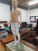* child mannequin on stand
